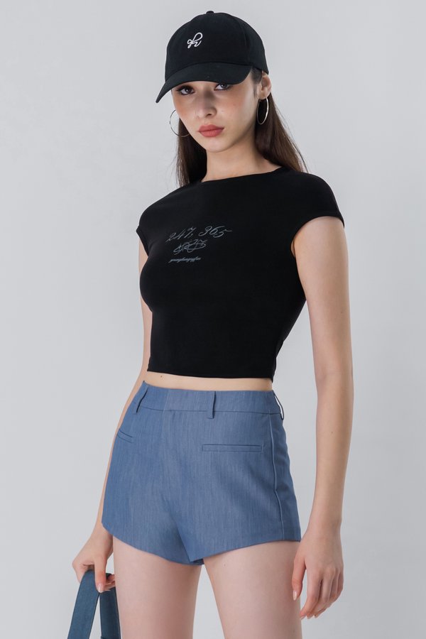 Knock Out Slant Hem Shorts in Denim Blue